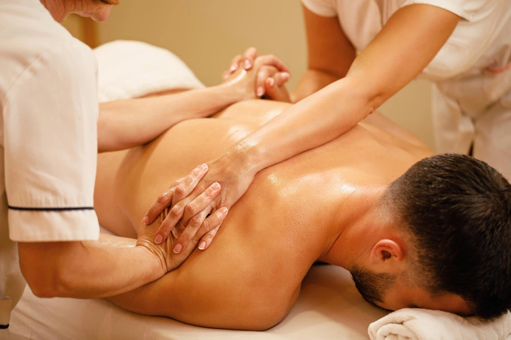 The Sensory Web: How a Four Hands Massage Creates Total Presence